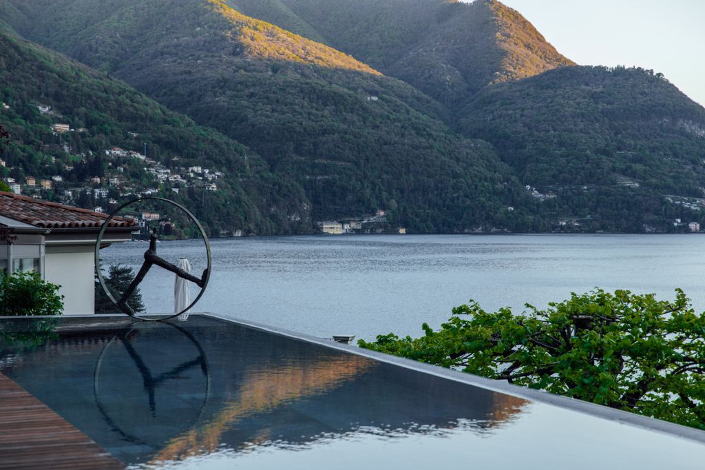 The white-washed buildings of Villa Lario perched on the cliffs of Lake Como.