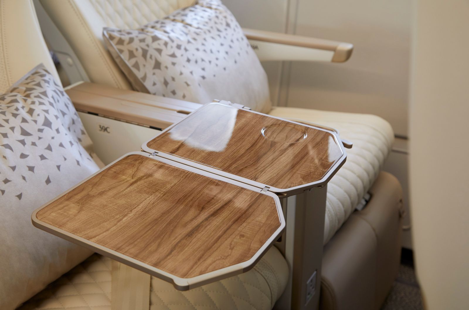 Close-up of the premium interior finishes and wood-grain textures in the Emirates cabin design.