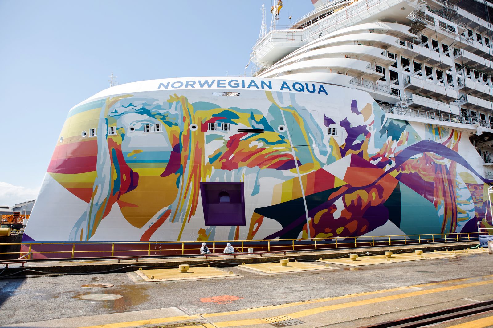 Close-up of the hull art and exterior of the Norwegian Aqua cruise ship.