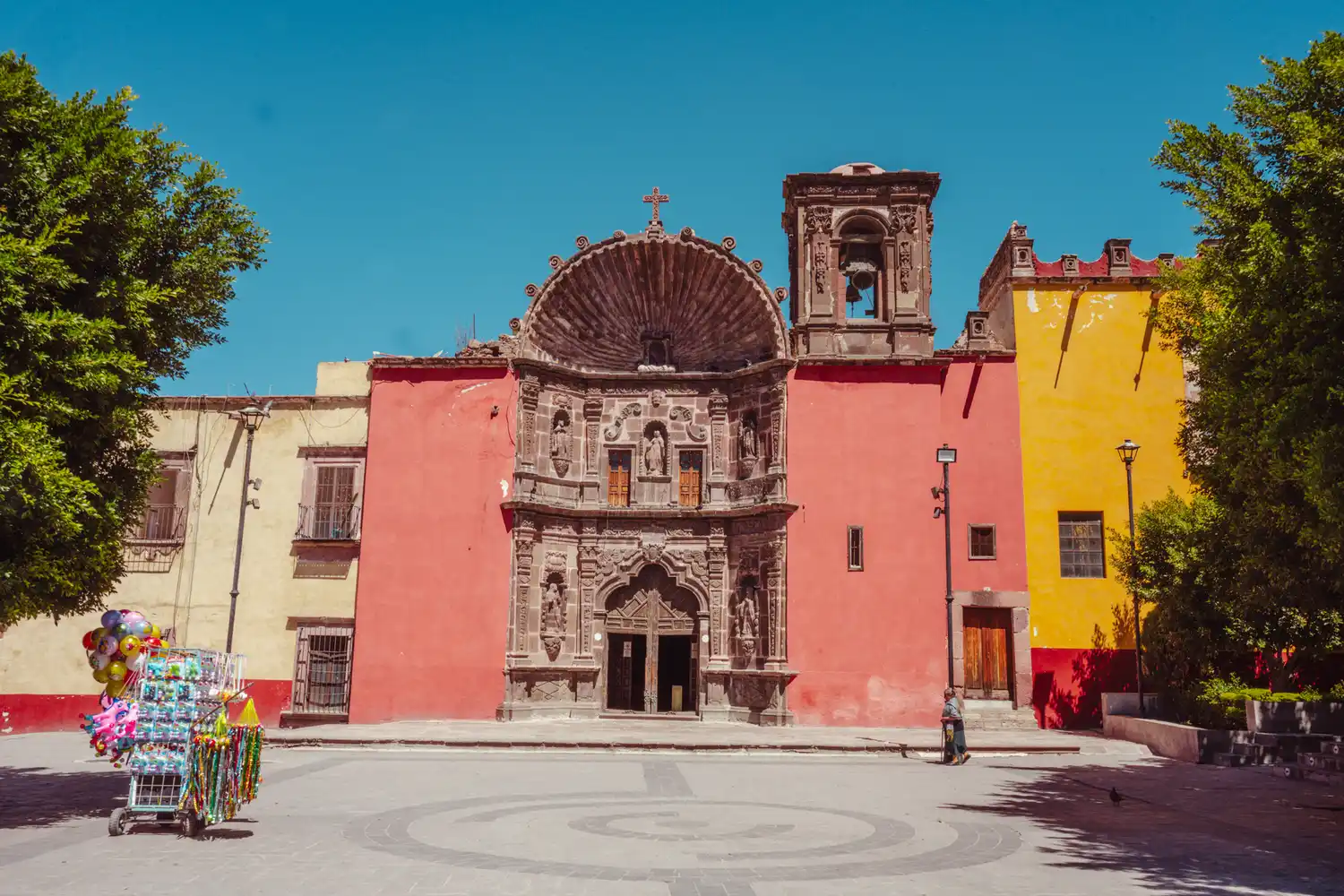 The ornate exterior of a historic cathedral in San Miguel de Allende, Mexico