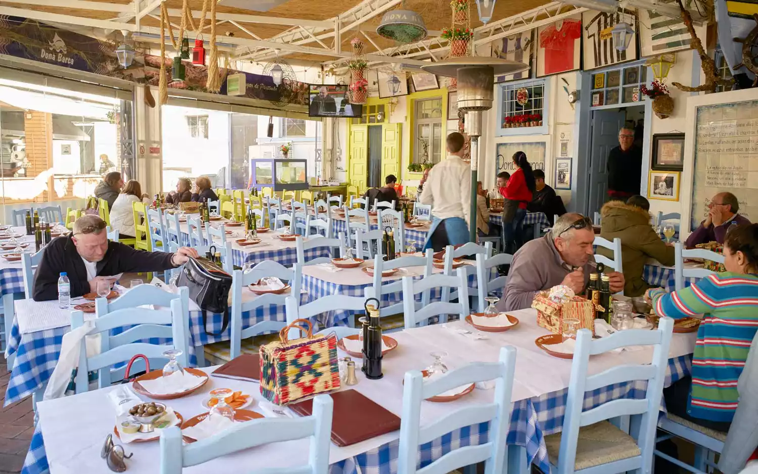 An outdoor fish restaurant with Mediterranean decor in the Algarve, Portugal.