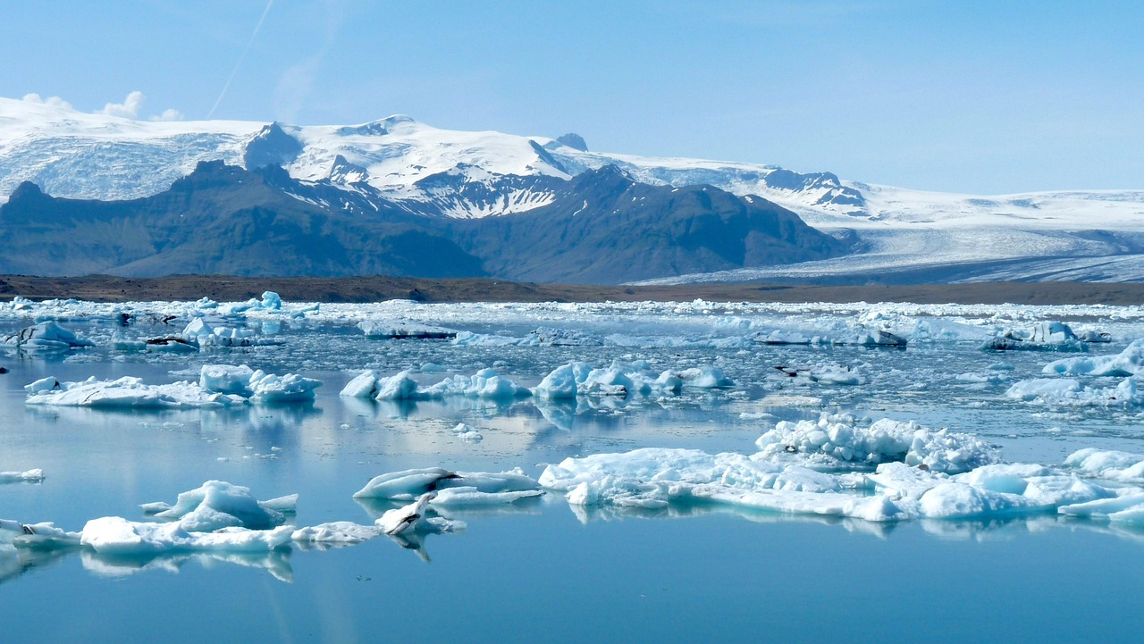 Step off the train and onto a raft to explore the floating icebergs of Spencer Glacier.