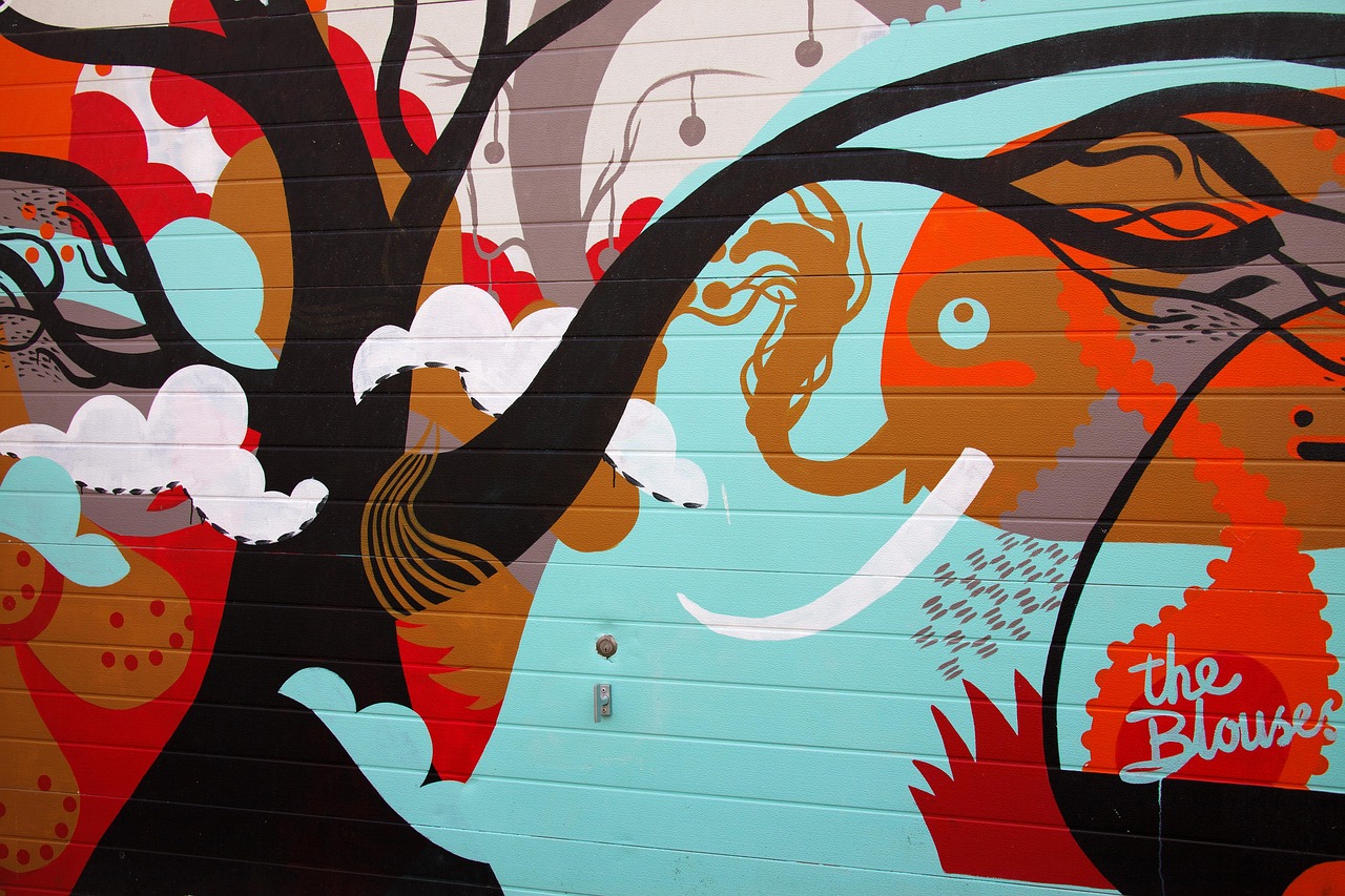 The Crossroads Arts District is a canvas for local queer expression and stunning street art.