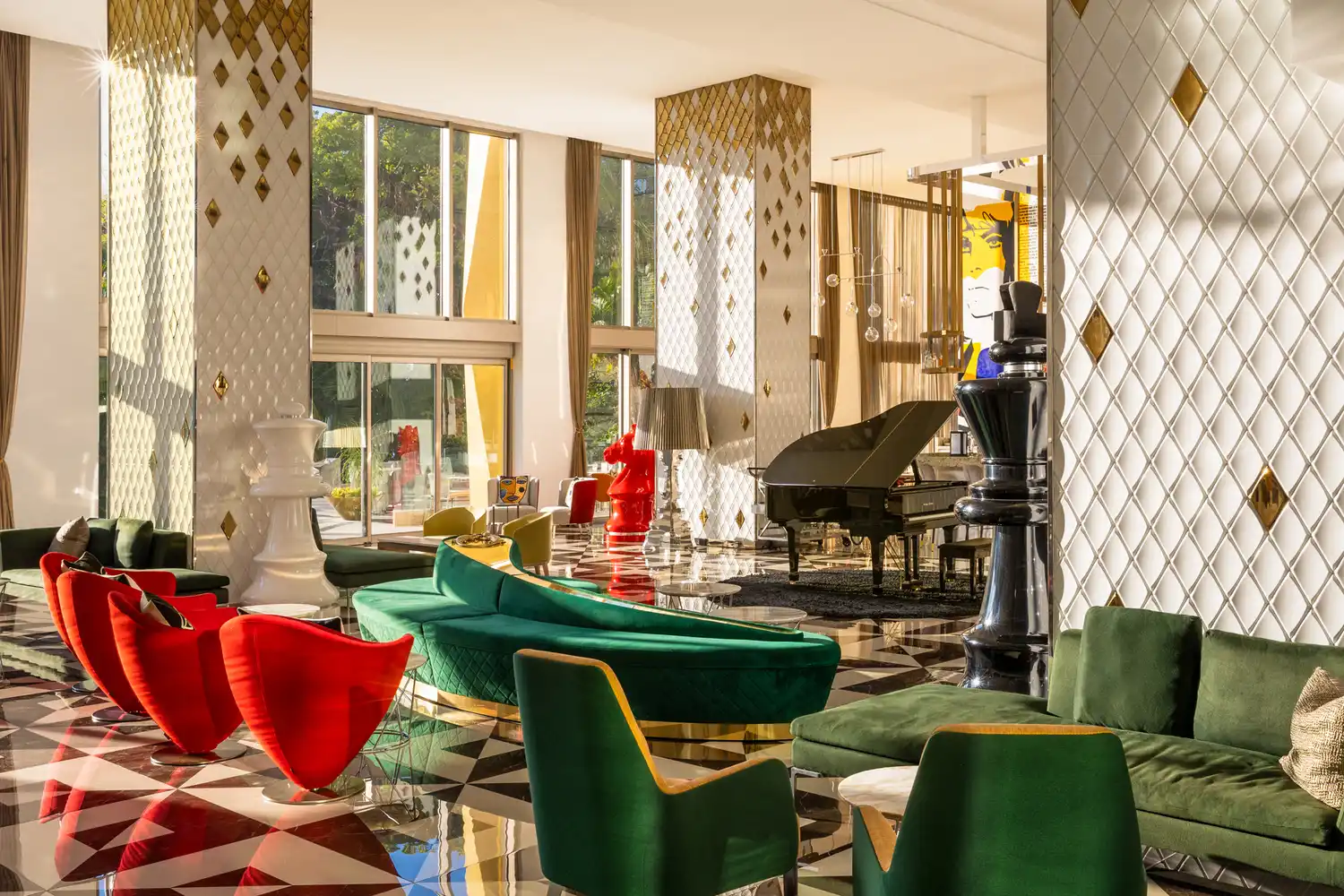 Modern and elegant interior lounge of Hotel Mousai with floor-to-ceiling glass windows.