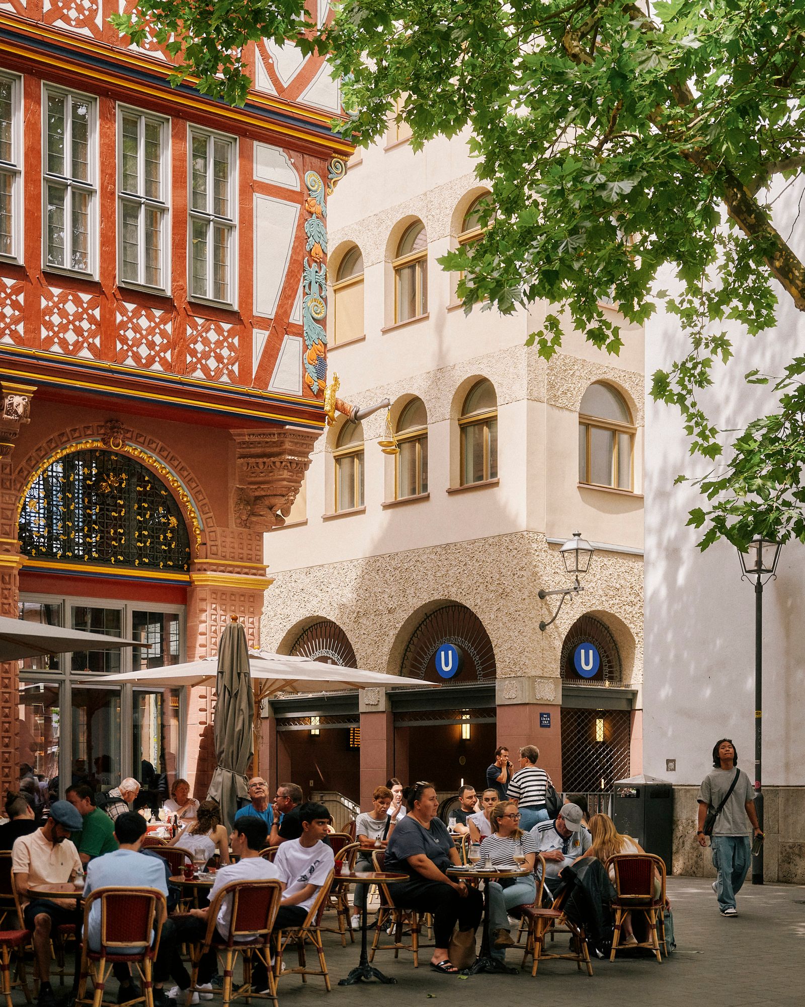 People enjoying the urban atmosphere inside a trendy Frankfurt cafe.