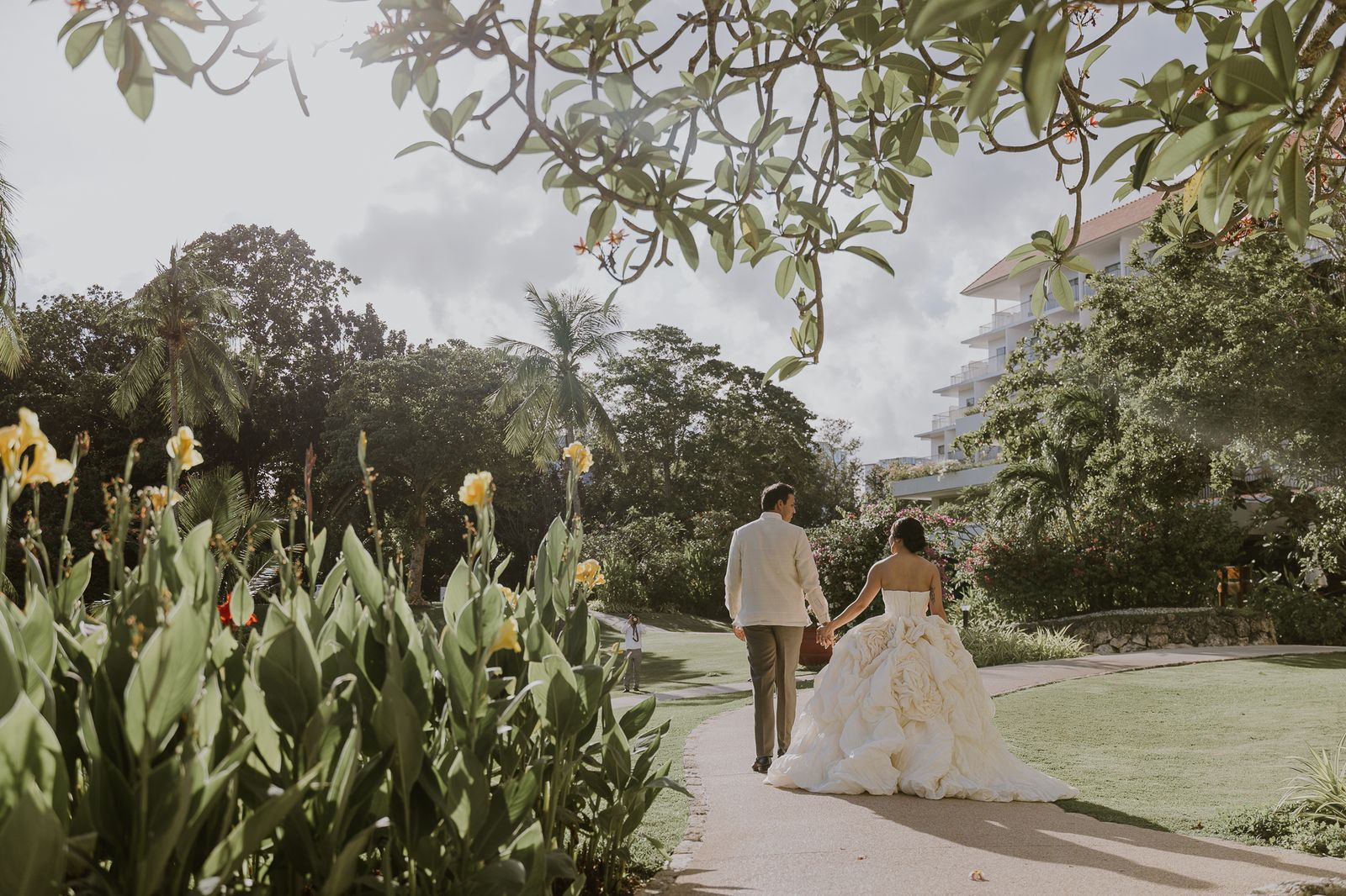 A close-up of a couple holding hands during a wedding ceremony.