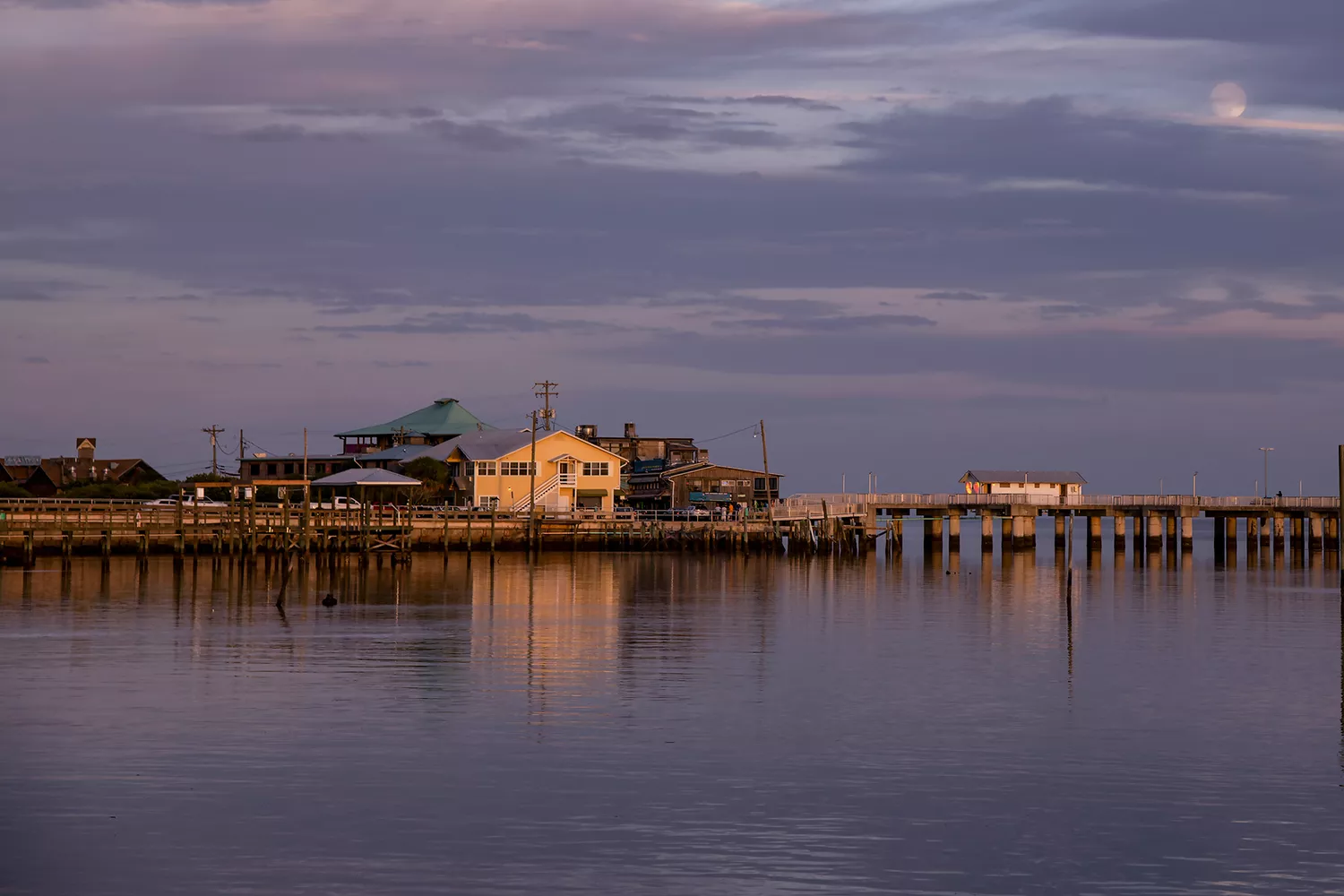 Evening sky with moonrise over Dock Street in Cedar Key, Florida.