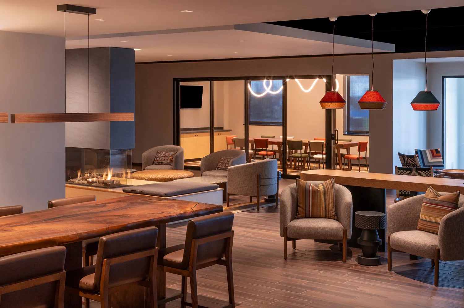 A modern lounge area with comfortable seating and contemporary lighting in The Wildbirch.