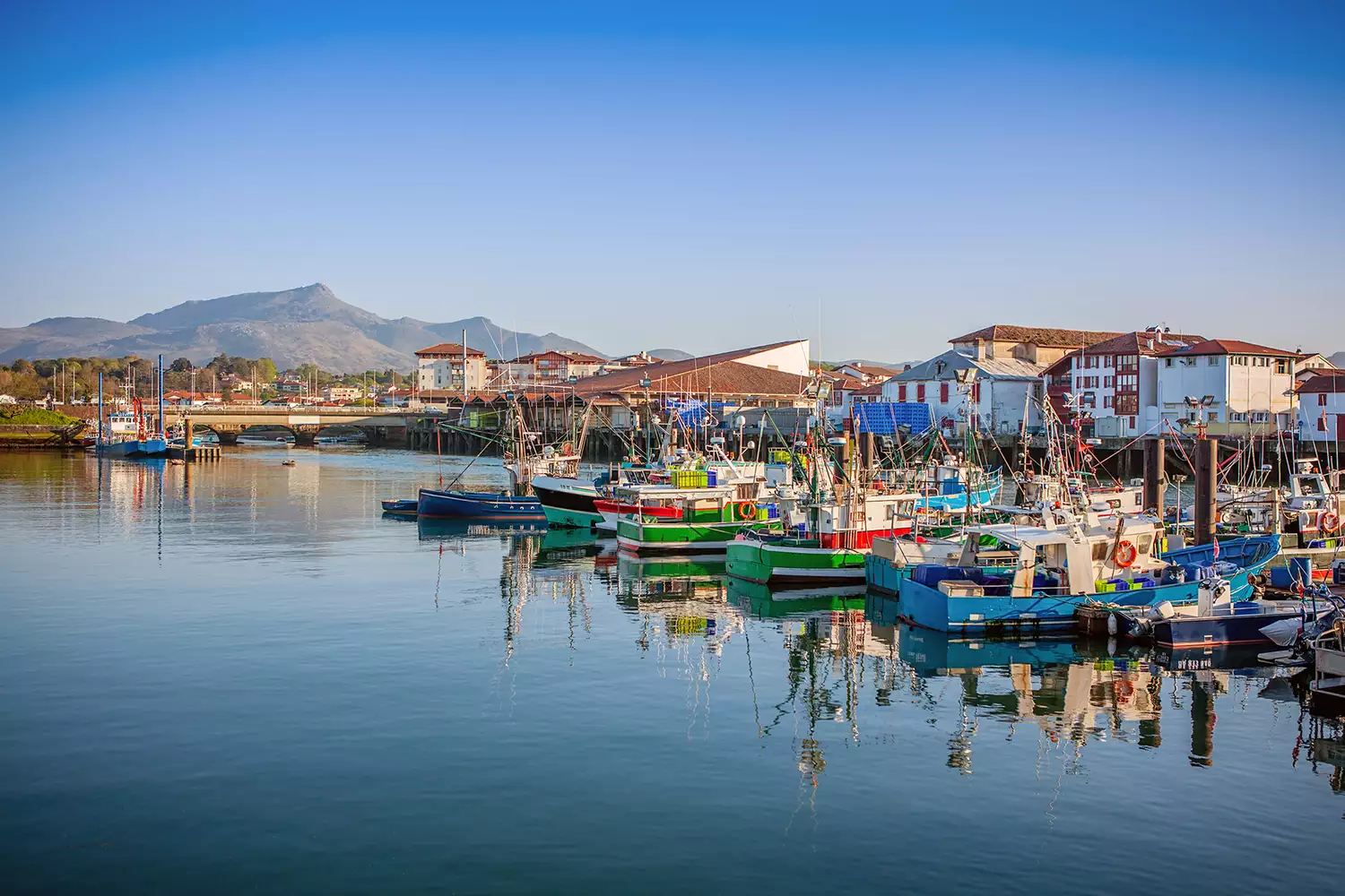 Traditional Basque architecture surrounding the peaceful harbor of Saint-Jean-de-Luz.