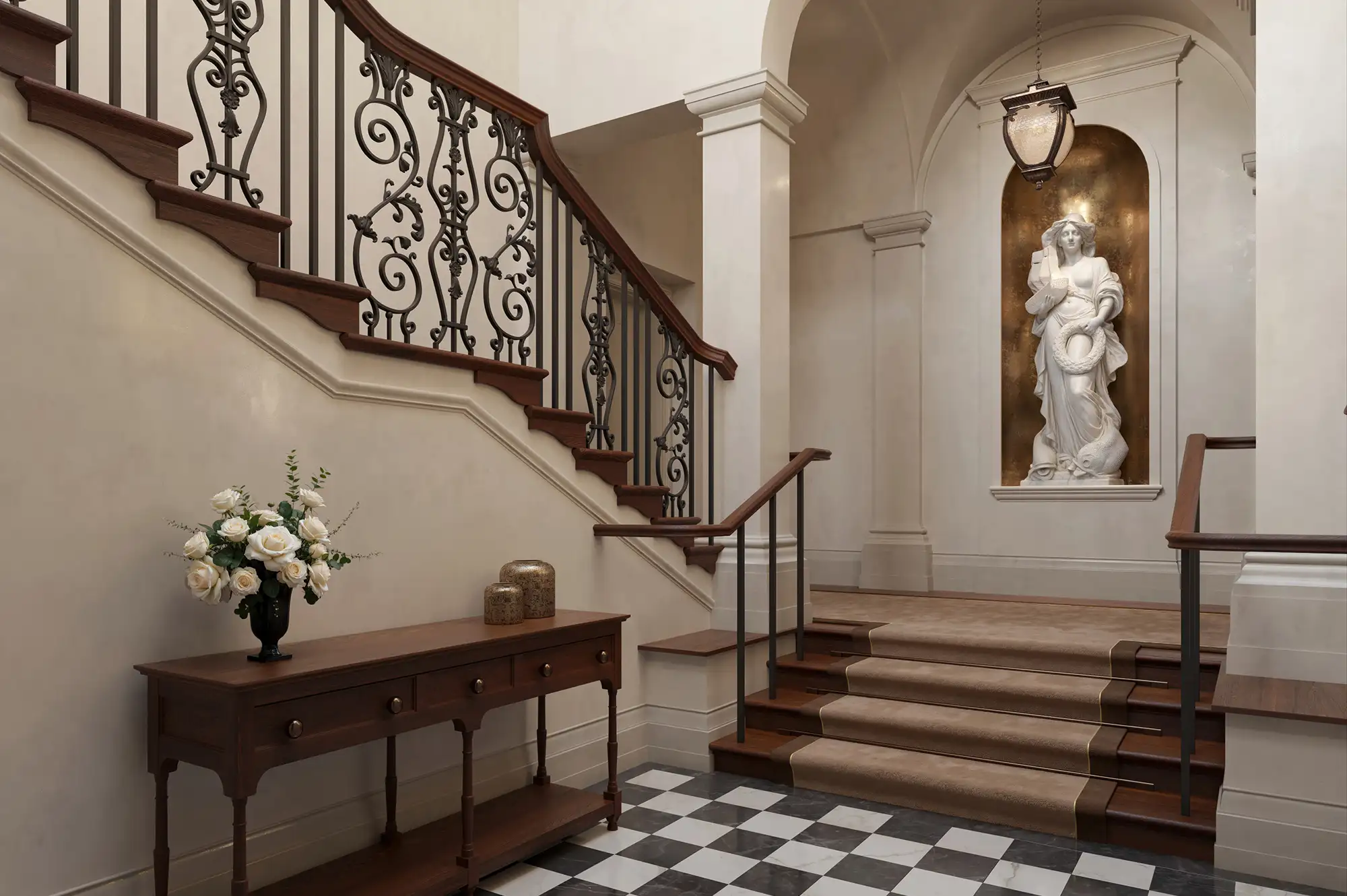 Elegant interior hallway featuring a classical statue in an alcove and a grand staircase.