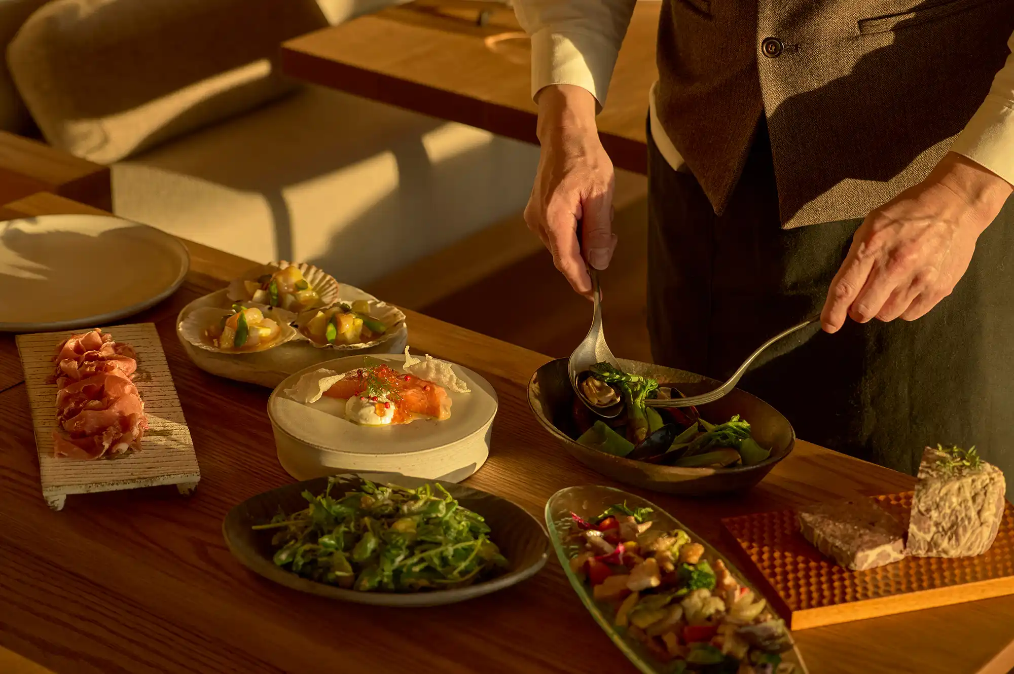 Table setting with various fresh farm-to-table dishes being served at the resort's restaurant.