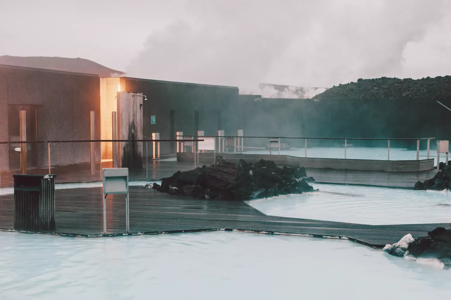 Steam rising from the milky blue geothermal waters of the Blue Lagoon.