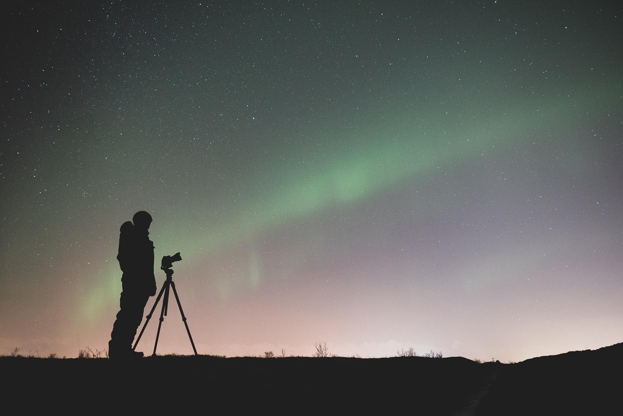 A tripod and long exposure settings are key to capturing the vibrant colors of the aurora.