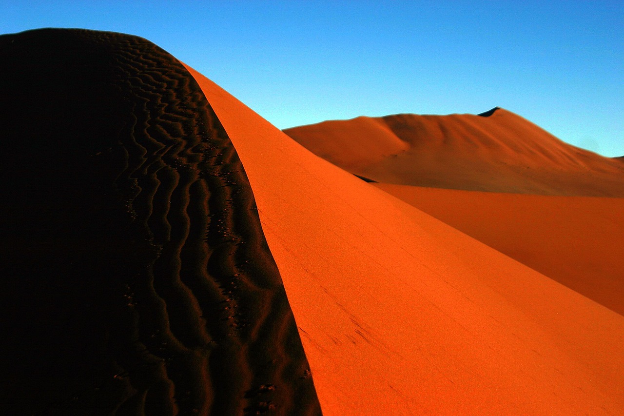 The stark, red dunes of the Namib Desert offer one of the most otherworldly landscapes on Earth.