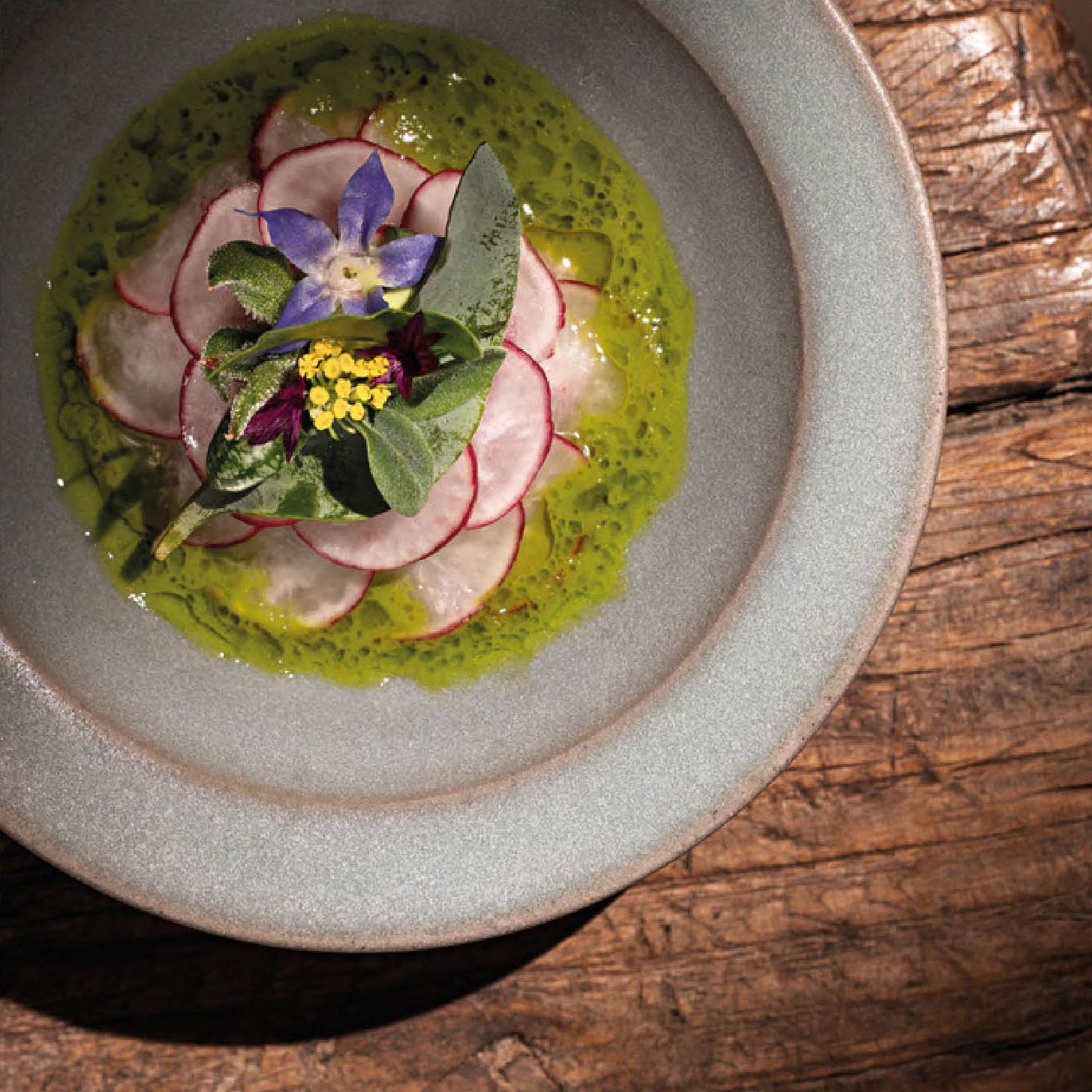 A meticulously plated gourmet dish representing fine dining in Frankfurt.